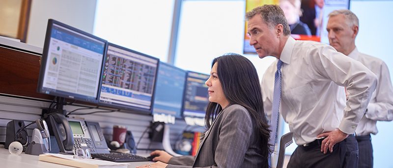 Broadridge_Action 640x274_Partner and Ivy working on computer.jpg